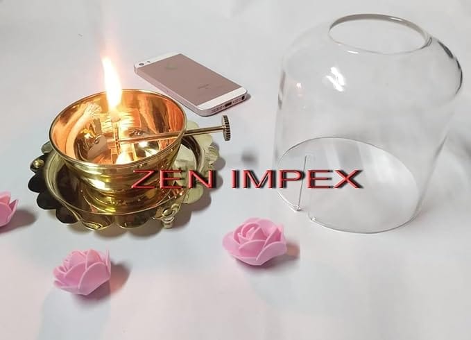 Premium brass Akhand Jyoth with glass chimney – golden brass diya featuring wick lifting screw lever, perfect for Diwali, Navratri pooja, and home temple decoration (6 x 5.5 inch).